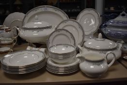 A partial Royal Doulton' York' dinner service to include tureens, bowls, platter,jug and plates.