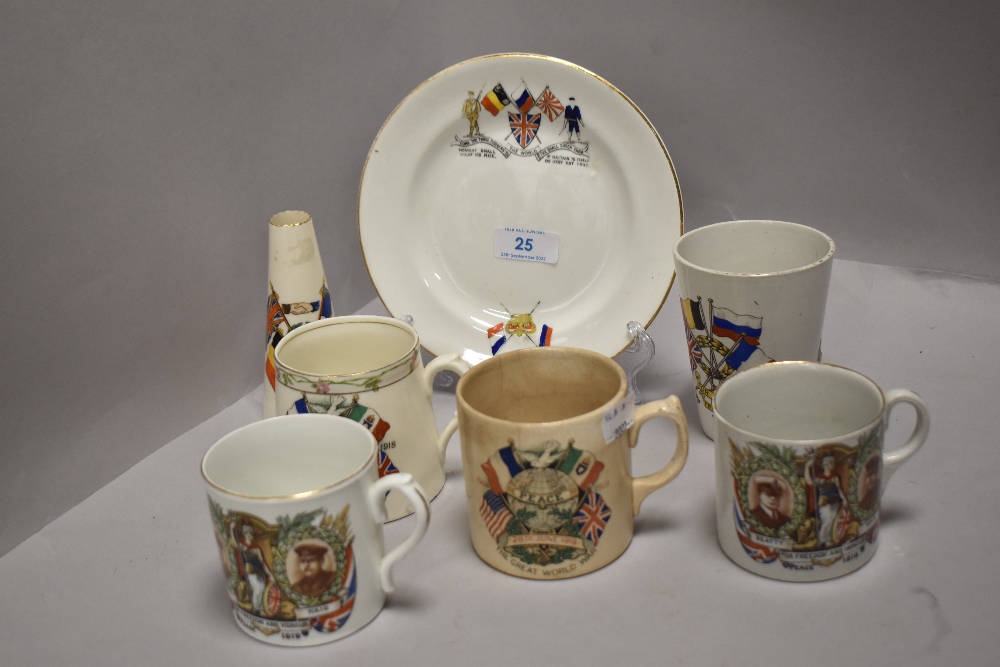 A collection of commemorative wear of WW1 interest, to include bud vase, mugs and plate.
