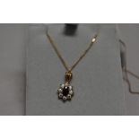 A sapphire and CZ cluster pendant in 9ct gold mount on 9ct gold chain, approx 18" & 2g