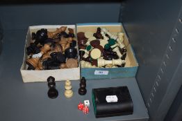 Two boxes of vintage chess pieces.