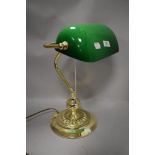 A 20th century office desk lamp having body with green and white glass shade