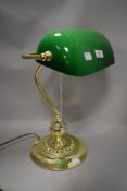 A 20th century office desk lamp having body with green and white glass shade