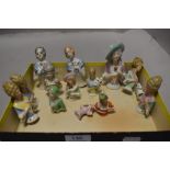 A selection of porcelain half body pin cushion crinoline dolls