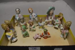 A selection of porcelain half body pin cushion crinoline dolls