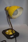 A min century industrial work light with yellow paint work