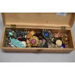 A Mauchline wear box containing a good quantity of vintage and retro costume jewellery.