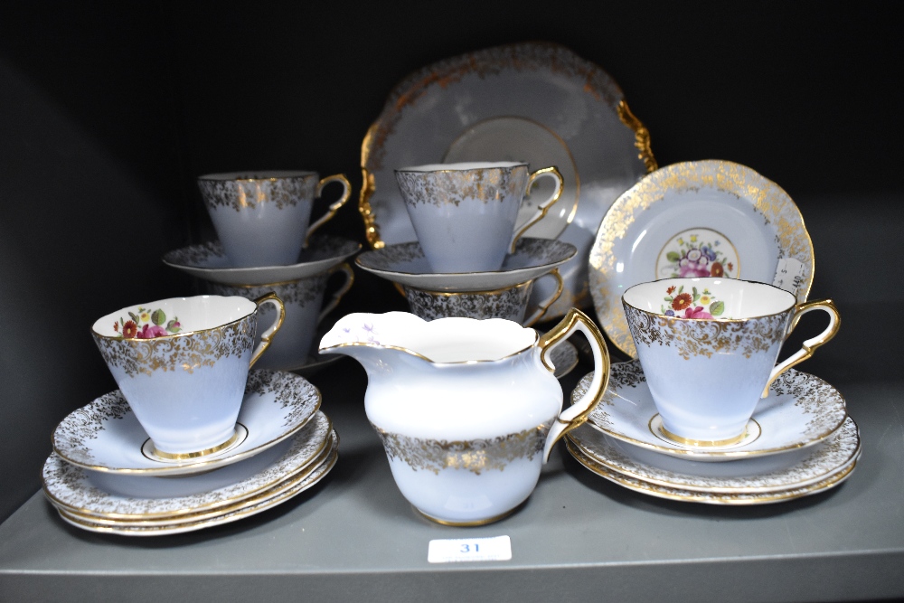 A partial Collingwood tea service, having pale blue ground, gilt motifs and floral design.