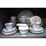 A partial Collingwood tea service, having pale blue ground, gilt motifs and floral design.