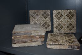 Six late 19th early 20th century Minton floor tiles having black and beige motifs to cream ground,