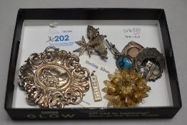 A selection of HM silver and white metal jewellery stamped silver including brooches, ingot