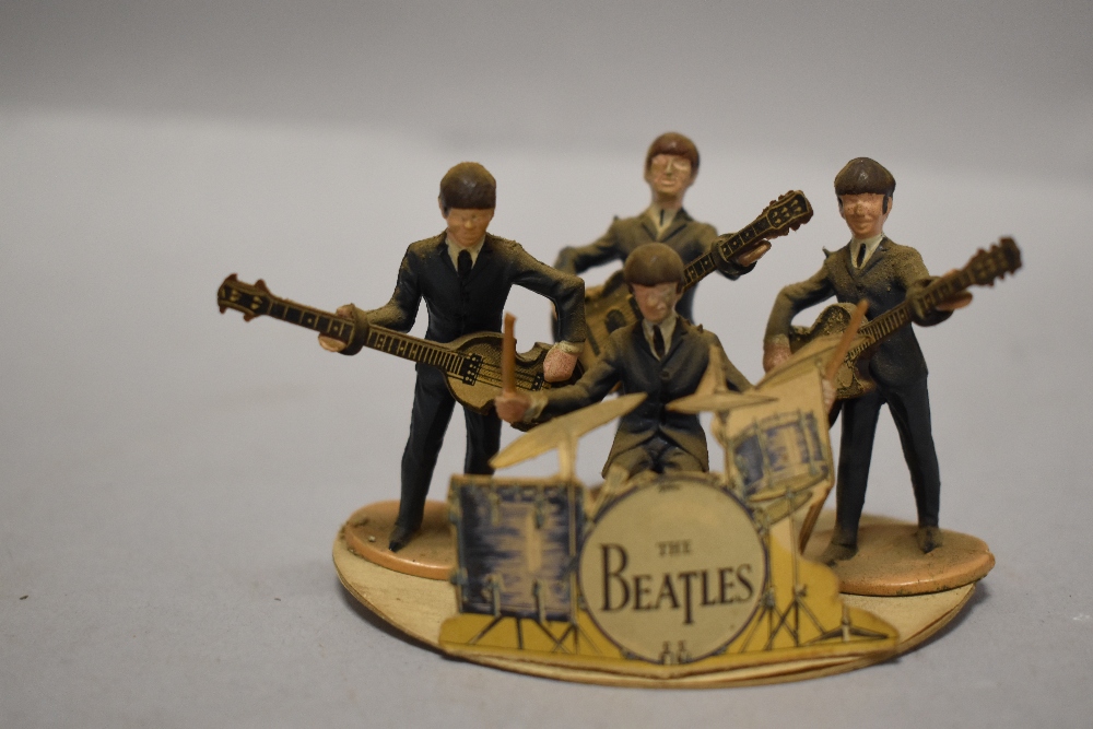 An Original 1960's Subbuteo Beatles Figure set, a set of four, with guitars and original card cut