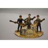 An Original 1960's Subbuteo Beatles Figure set, a set of four, with guitars and original card cut