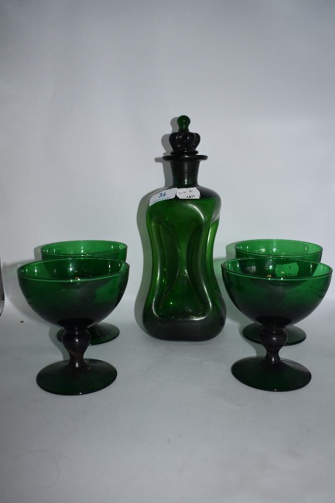 A mid century green glass Kluk-Kluk decanter and four glasses.