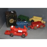 A vintage wooden toy train and a safe.