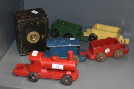 A vintage wooden toy train and a safe.