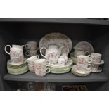 A 20th century Royal Doulton dinner and breakfast service over two shelfs in the Expressions