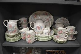 A 20th century Royal Doulton dinner and breakfast service over two shelfs in the Expressions