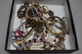 A selection of costume jewellery and similar including vintage watch, bangles, dress clips and