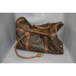 A vintage Louis Vuitton holdall, purchased as original, however, no provenance. brass Eclair zips,