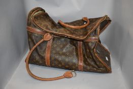 A vintage Louis Vuitton holdall, purchased as original, however, no provenance. brass Eclair zips,