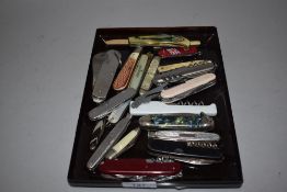 A selection of pocket and pen knives including Swiss style