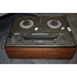 A Tandberg cross field reel to reel tape recorder.