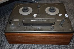 A Tandberg cross field reel to reel tape recorder.