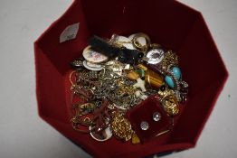 A selection of mixed costume jewellery including rings, necklaces and badges