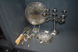 A mixed lot of flat ware, candlestick, decorative fish servers, tray and more amongst this lot.