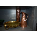 An Arts and Crafts hammered effect three footed brass bowl, a jug having Art Nouveau impressed