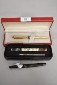 A selection of pens, amongst which are a Gold plated Sheaffer fountain pen, A Platignum Ensign