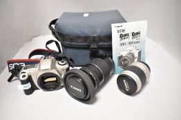 A Canon EOS300 camera body with EF 75-300mm 1;4-5,5 zoom lens and EF 28-90mm 1;4-5,6 lens in soft