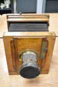 A 19th century wood and brass folding bellow optical field camera