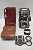 A Rolleiflex Reflex camera with Carl Zeiss Planer 75mm f3,5 lens in leather cover