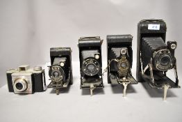 Four Kodak folding cameras, a No1A, a No2, a Six-20 Junior, and a Canadian made Vest Pocket Kodak