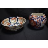 Two pieces of Japanese Imari wares including ovoid vase with decorated panels of Prunus and a footed