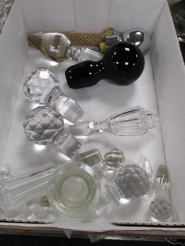 A selection of cut and blown glass decanter stoppers