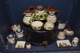 A selection of 20th century Watcombe Torquay pottery motto wares including large teapot, small