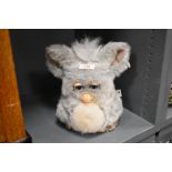 A 2005 Hasbro mechanical toy Furby in grey fur