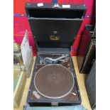 A HMV gramophone with a selection of 78rpm shellac records