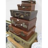 A selection of early 20th century and later leather bound briefcase or suitcase in vary sizes and