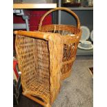 Two modern woven wicker baskets, one for logs and similar laundry basket