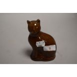 A late 19th century treacle glazed money box or bank in the form of a tabby cat
