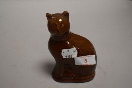 A late 19th century treacle glazed money box or bank in the form of a tabby cat