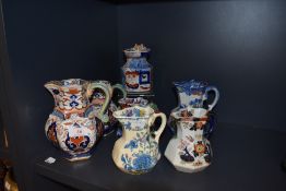 A selection of 20th century Masons and similar water and milk jugs including Fenton and Ironstone