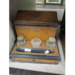 A late Victorian desk top writing or stationary set with drawer storage and ink wells