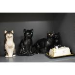 A selection of modern cat figures including Sylvac butter dish, Babbacombe cat figure and Sia cat