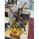 A selection of treen wood items including Indian table bases, chess board, money box and container