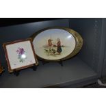 An early 20th century tray with oval brass surround and printed tile depicting a Dutch girl
