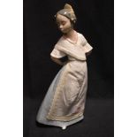 A 20th century Nao figurine of a maiden in dress